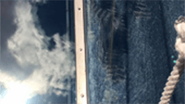Professional window cleaners working on a multi-story building