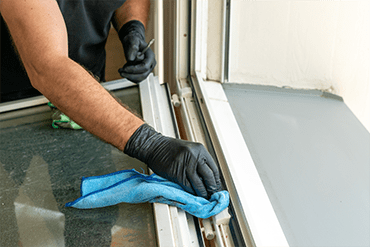 Window sill and track cleaned of greasy grime buildup by Sun Services, Inc.